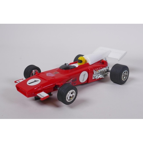 108 - Four 1970s Scalextric cars, to include a Ferrari 312 C.025, a March Ford 721 C.026, a JPS Lotus 72D ... 