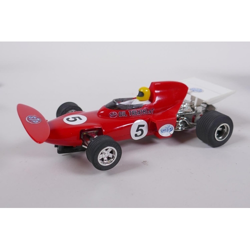 108 - Four 1970s Scalextric cars, to include a Ferrari 312 C.025, a March Ford 721 C.026, a JPS Lotus 72D ... 