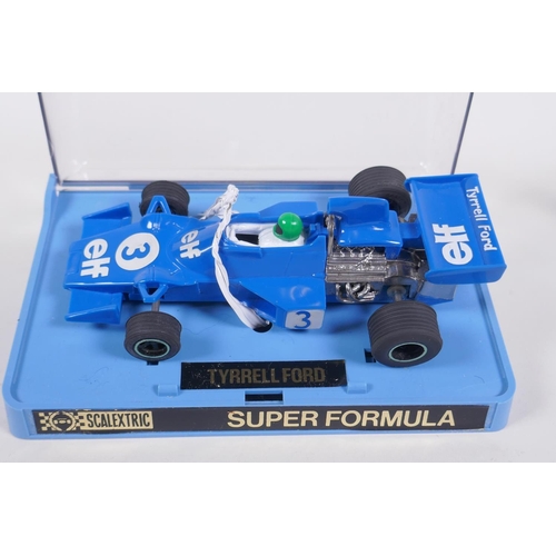 108 - Four 1970s Scalextric cars, to include a Ferrari 312 C.025, a March Ford 721 C.026, a JPS Lotus 72D ... 