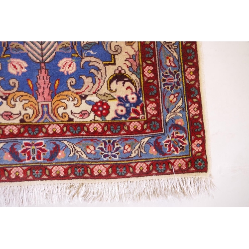 1080 - An Iranian cream ground wool rug with blue and red panelled design, 112 x 156cm