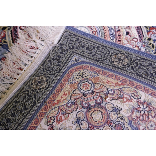 1081 - An Iranian fine woven blue ground runner with a medallion design surrounded by an embossed all over ... 