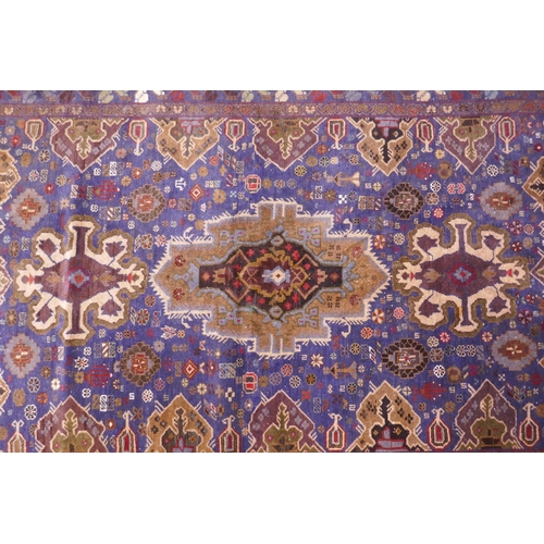 1083 - A hand woven blue ground wool Persian Belouch nomadic rug, 190 x 120cm