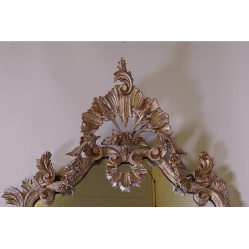 1085 - A Venetian carved wood wall mirror with silver leaf decoration, AF losses