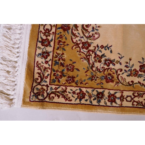 1086 - A pair of gold ground Kashmir runners with a floral medallion design, 142 x 68cm