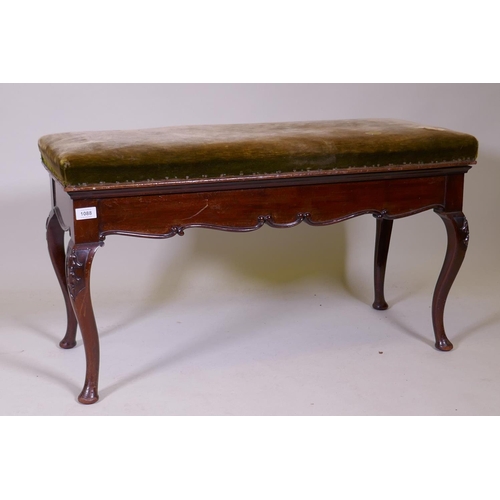 1088 - A Victorian mahogany duet stool with carved decoration, raised on cabriole supports, 93 x 40 x 50cm