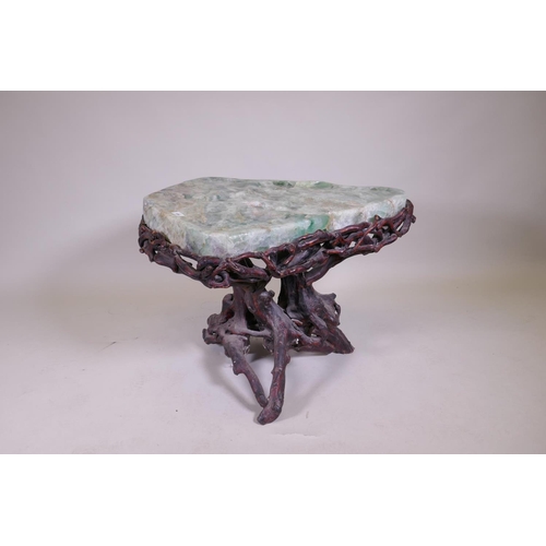 1090 - An oriental green quartz/fluorspar top table, raised on a rootwood base, AF, 80 x 65 x 56cm