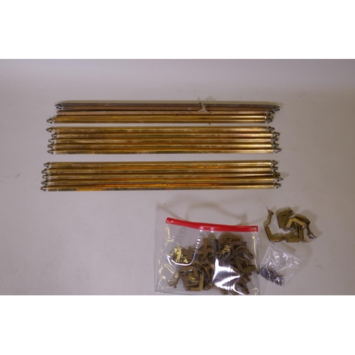 1095 - A quantity of vintage solid brass stair rods of triangular form with fleur de lis finials and fixing... 