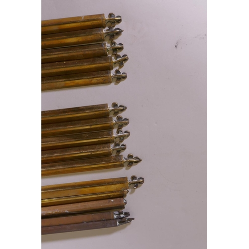 1095 - A quantity of vintage solid brass stair rods of triangular form with fleur de lis finials and fixing... 