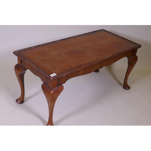 1096 - A Queen Anne style coffee table with figured walnut top and inset glass, labelled H. Shaw, London, 9... 