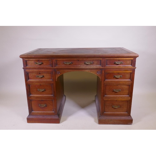 1097 - A fine quality solid walnut kneehole desk with inset gilt tooled leather top stamped Howard & So... 