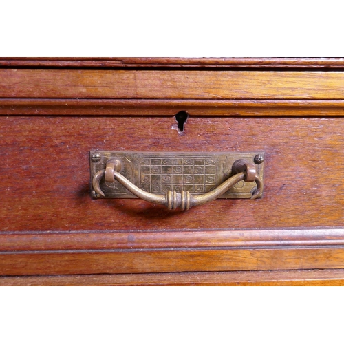 1097 - A fine quality solid walnut kneehole desk with inset gilt tooled leather top stamped Howard & So... 