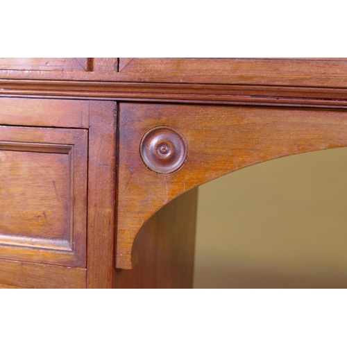 1097 - A fine quality solid walnut kneehole desk with inset gilt tooled leather top stamped Howard & So... 