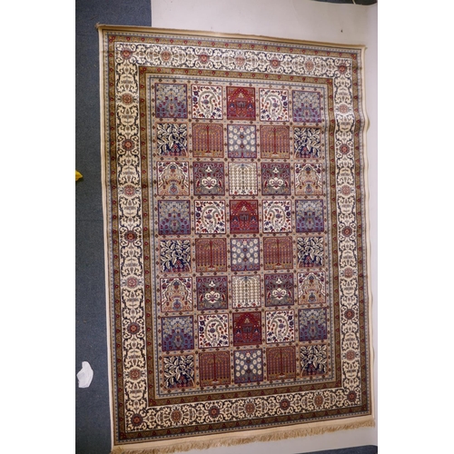 1098 - A full pile ivory ground Kashmir carpet with a Persian panel design, 156 x 230cm