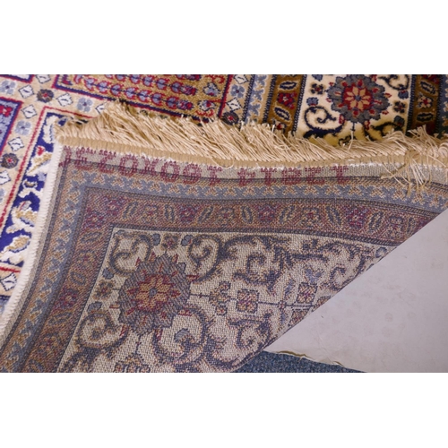 1098 - A full pile ivory ground Kashmir carpet with a Persian panel design, 156 x 230cm