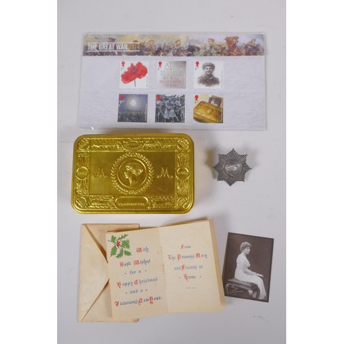 11 - A WWI Queen Mary Christmas 1914 gift tin, with contents, cigarettes unopened, tobacco package (broke... 