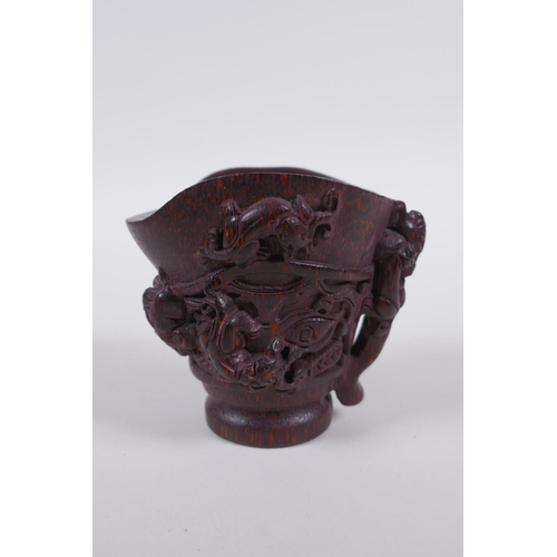 115 - A Chinese carved bamboo libation cup with climbing kylin decoration, impressed seal mark to base, 8c... 