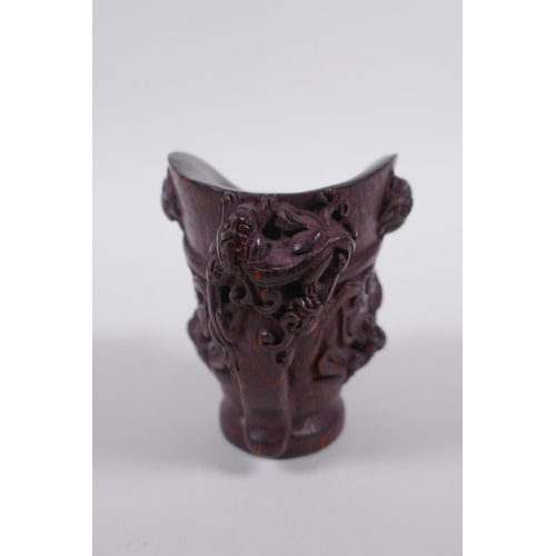 115 - A Chinese carved bamboo libation cup with climbing kylin decoration, impressed seal mark to base, 8c... 