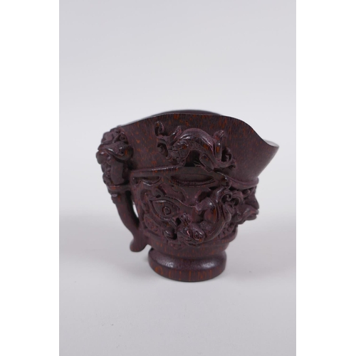 115 - A Chinese carved bamboo libation cup with climbing kylin decoration, impressed seal mark to base, 8c... 