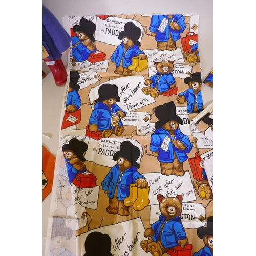 120 - A Paddington Bear by Gabrielle designs, AF tatty coat, two aprons and a mug, and five Paddington's A... 