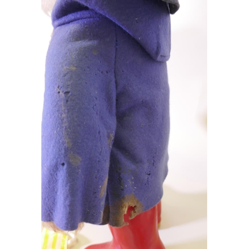 120 - A Paddington Bear by Gabrielle designs, AF tatty coat, two aprons and a mug, and five Paddington's A... 