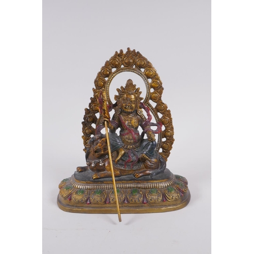 121 - A Sino Tibetan painted bronze figure of a deity seated on a mythical creature, 4 character mark to b... 