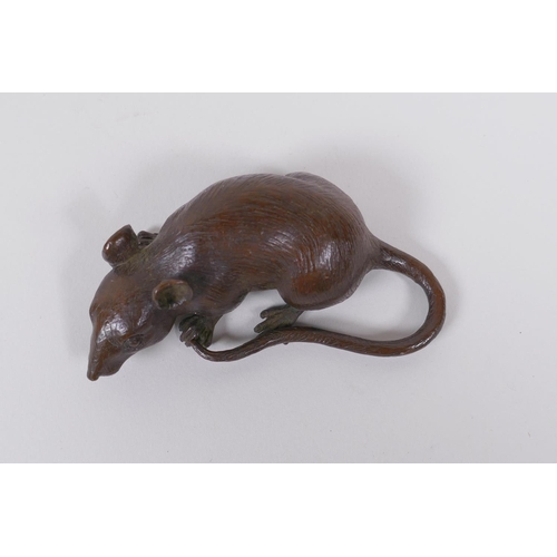 126 - A Japanese style bronze okimono rat, impressed mark to base, 9cm long