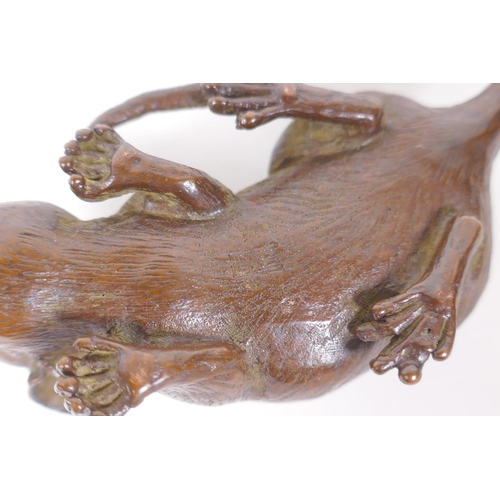 126 - A Japanese style bronze okimono rat, impressed mark to base, 9cm long