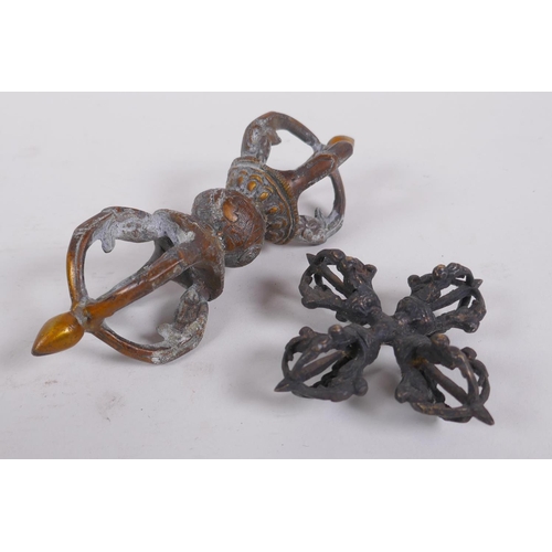 127 - A Tibetan bronze double vajra, together with a larger vajra, 16cm long