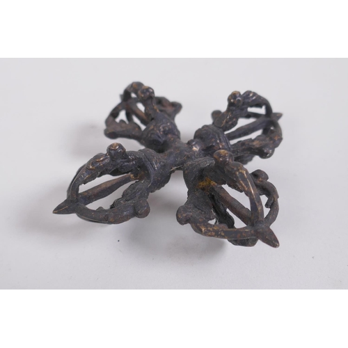 127 - A Tibetan bronze double vajra, together with a larger vajra, 16cm long