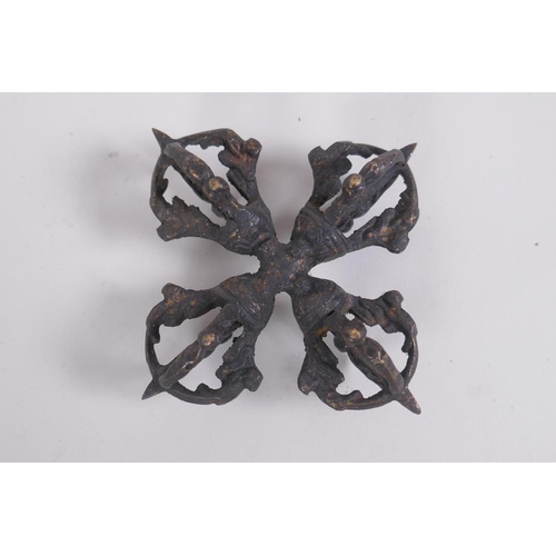 127 - A Tibetan bronze double vajra, together with a larger vajra, 16cm long