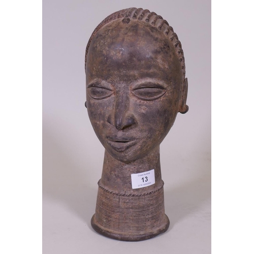 13 - An African bronze bust, head of a female with braided hair, 33cm high