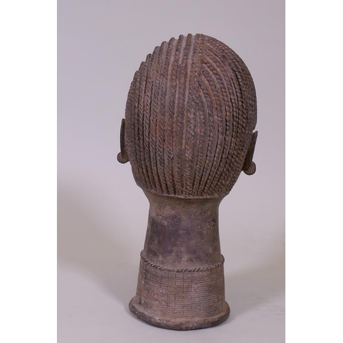 13 - An African bronze bust, head of a female with braided hair, 33cm high