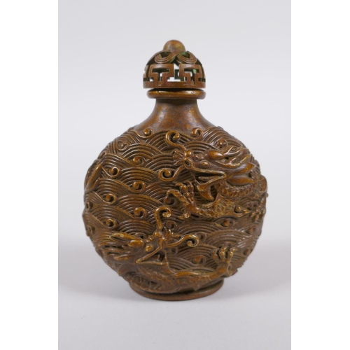 135 - A Chinese bronze snuff bottle with raised dragon decoration, impressed 4 character mark to base, 8cm... 