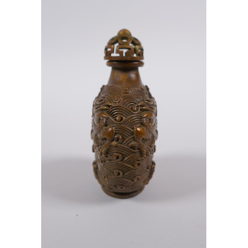 135 - A Chinese bronze snuff bottle with raised dragon decoration, impressed 4 character mark to base, 8cm... 