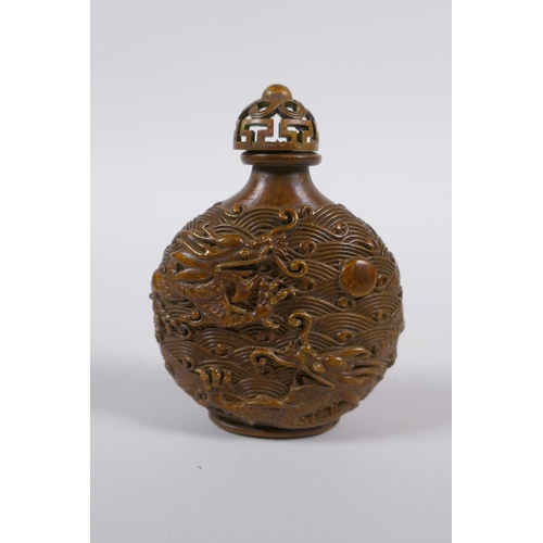 135 - A Chinese bronze snuff bottle with raised dragon decoration, impressed 4 character mark to base, 8cm... 