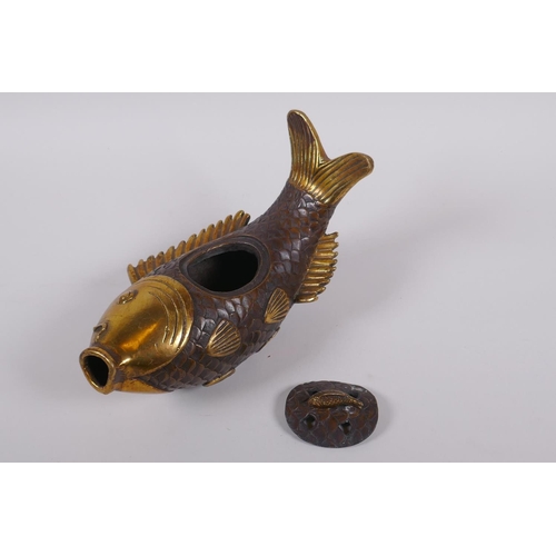 141 - A Chinese gilt bronze censer and cover in the form of a carp, 22cm long, mark to base