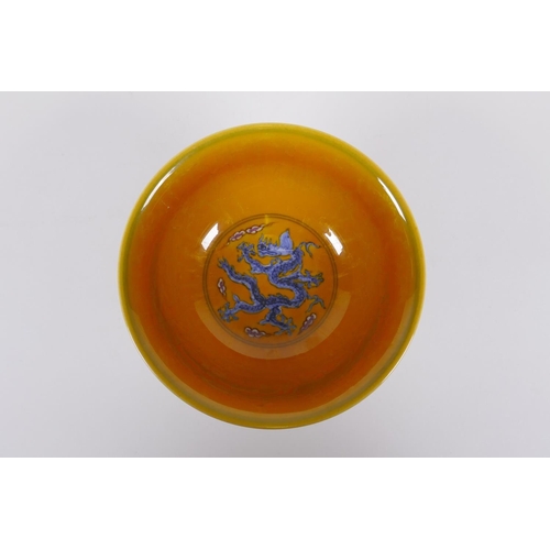 148 - A Chinese yellow ground porcelain stem bowl with blue and white dragon decoration, Chenghua 6 charac... 