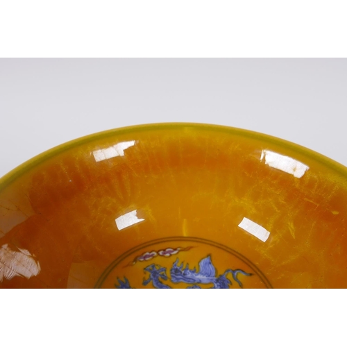 148 - A Chinese yellow ground porcelain stem bowl with blue and white dragon decoration, Chenghua 6 charac... 