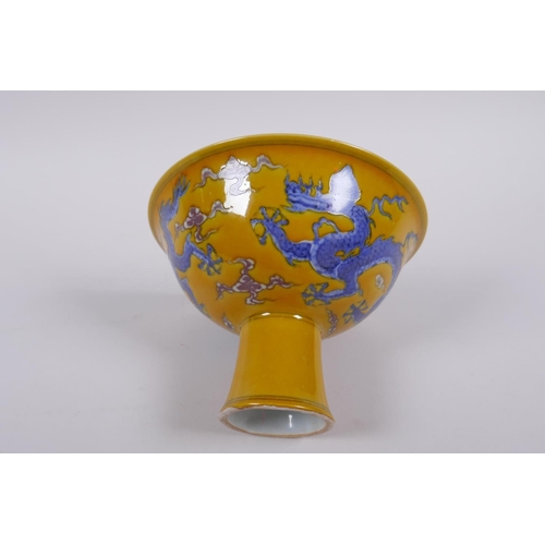 148 - A Chinese yellow ground porcelain stem bowl with blue and white dragon decoration, Chenghua 6 charac... 