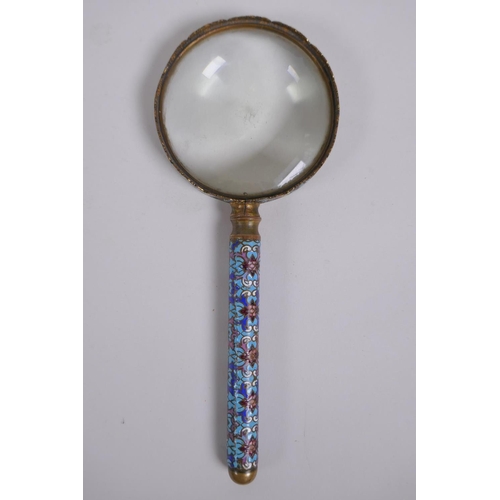 149 - An antique continental brass and cloisonne magnifying glass, 22cm long