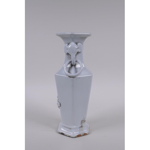 150 - A Chinese blanc de chine porcelain vase of hexagonal form with two loop handles and raised prunus bl... 