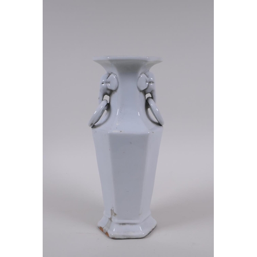 150 - A Chinese blanc de chine porcelain vase of hexagonal form with two loop handles and raised prunus bl... 