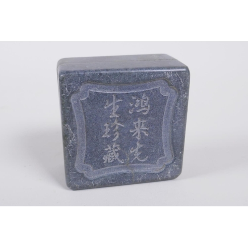 155 - A Chinese hardstone box with carved lotus flower decoration to the cover, containing an amber soapst... 