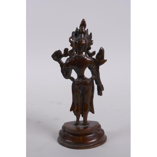 156 - An Indian bronze figure of a standing female deity, 16cm high