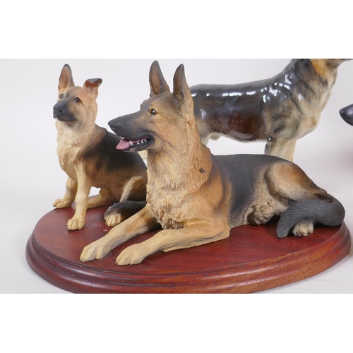 157 - Royal Doulton figure of a German Shepherd dog, two Goebel figures of the same and another, largest 2... 