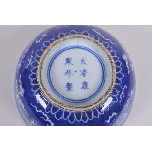 158 - A Chinese blue and white porcelain rice bowl with dragon decoration, Kangxi 6 character mark to base... 