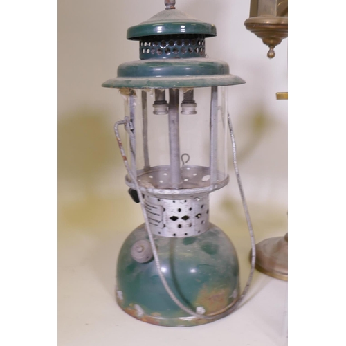 166 - An Akrom pressurised spirit lamp, a brass lamp, garden lanterns AF, and laboratory stands