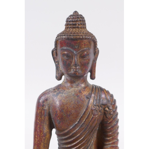 168 - A Sino Tibetan gilt bronze figure of Buddha, 20cm high