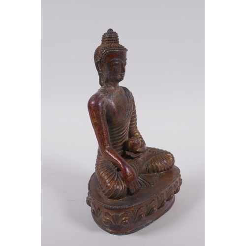 168 - A Sino Tibetan gilt bronze figure of Buddha, 20cm high