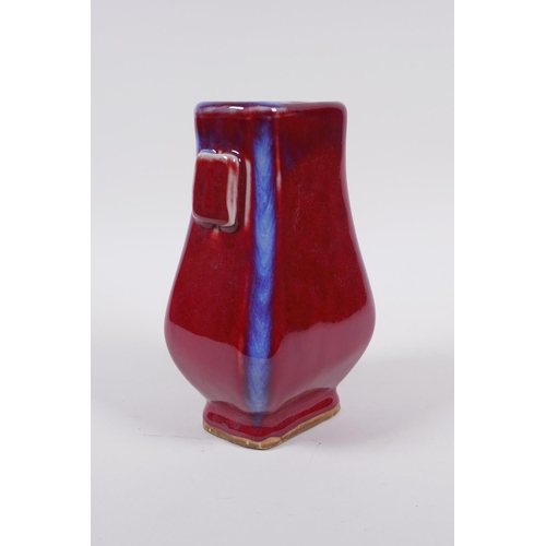 173 - A Chinese flambe glazed porcelain vase with two lug handles, mark to base, 17cm high